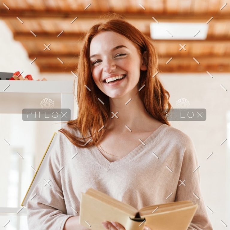happy-redhead-young-lady-student-reading-book-M5Z7RVC@2x-1